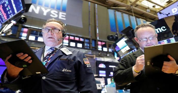 Traders work on the floor of the NYSE in New York