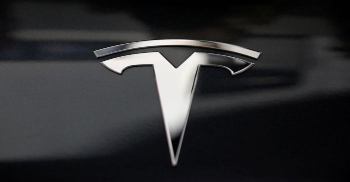 FILE PHOTO: A Tesla logo is seen in Los Angeles