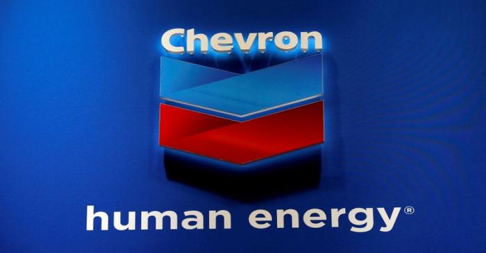 FILE PHOTO: The logo of Chevron Corp is seen in its booth at Gastech, the world's biggest expo