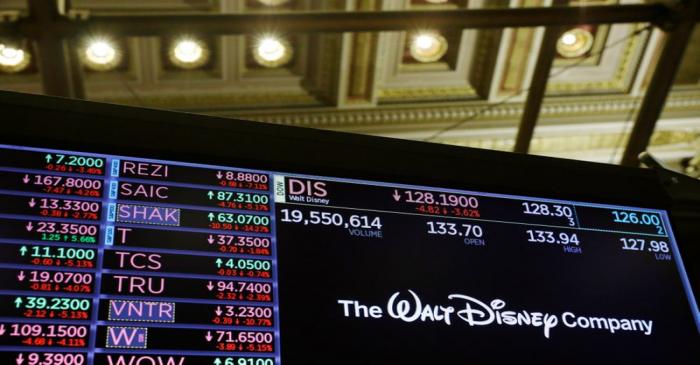 The logo of the Walt Disney Company is displayed above the floor of the New York Stock Exchange