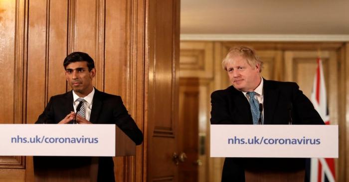 Britain's Prime Minister Boris Johnson and Chancellor of the Exchequer Rishi Sunak attend a