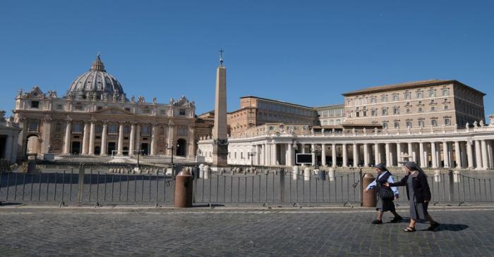 FILE PHOTO: Nuns walk past a deserted St Peter's Square in Rome