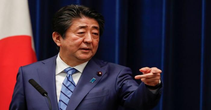 Japan's Prime Minister Shinzo Abe gestures as he speaks during a news conference on Japan's