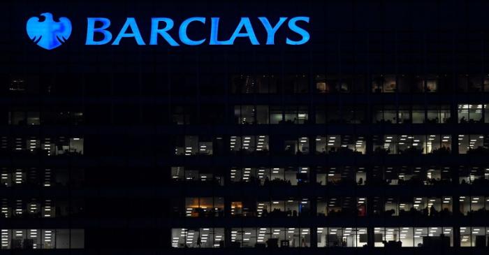 Workers are seen in at Barclays bank offices in the Canary Wharf financial district in London