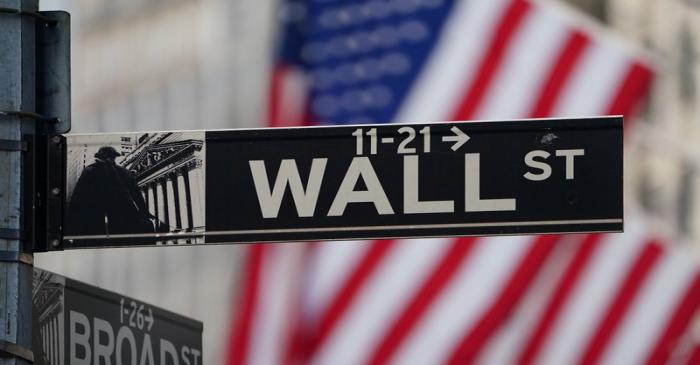 FILE PHOTO: The Wall Street sign is pictured at the New York Stock exchange (NYSE) in the