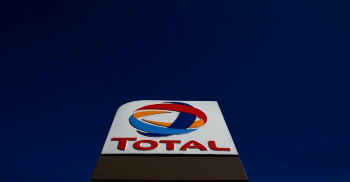 The logo of French oil and gas company Total is seen in a petrol station in Paris