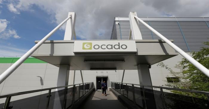 A man walks from the main reception of the Ocado CFC (Customer Fulfilment Centre) in Andover