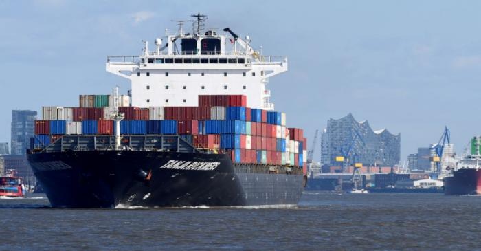 FILE PHOTO: A container ship leaves the port in front of famous landmark Philharmonic Hall in