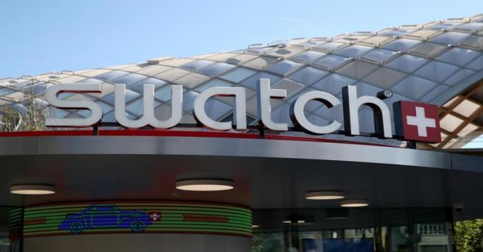 FILE PHOTO: A Swatch logo is pictured in front of the newly built headquarters in Biel