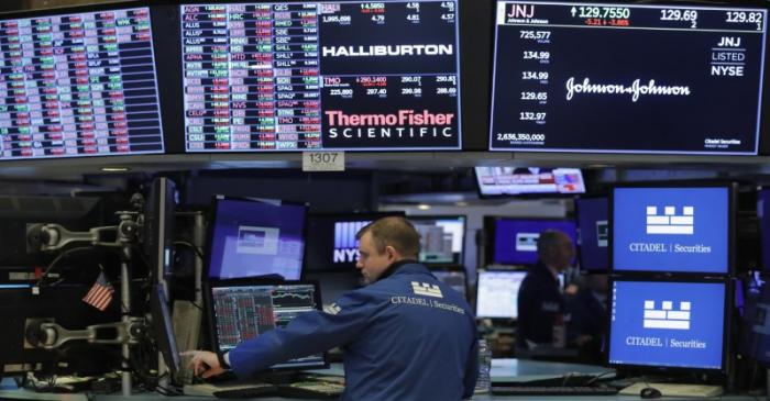 Traders work on the floor of the NYSE in New York