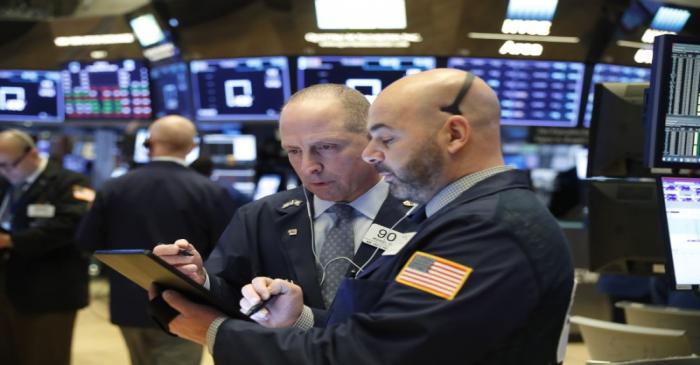 Traders work on the floor of the NYSE in New York