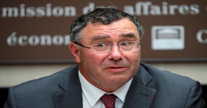 FILE PHOTO: Total CEO Patrick Pouyanne attends a hearing of French parliament's economic