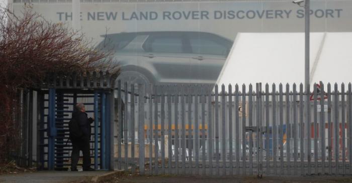 A worker arrives at Jaguar Land Rover's Halewood Plant in Liverpool