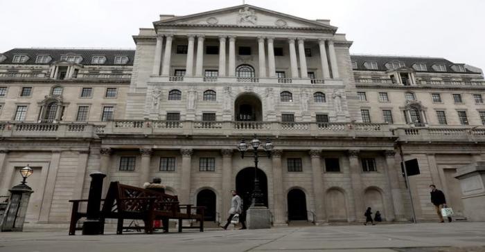 People walk in front of the Bank of England, as the number of coronavirus disease (COVID-19)