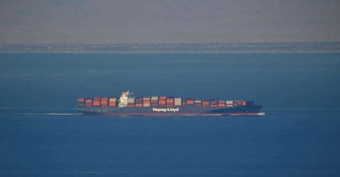 A Hapag Lloyd container ship sails across the Gulf of Suez Canal, in El Ain El Sokhna in Suez,