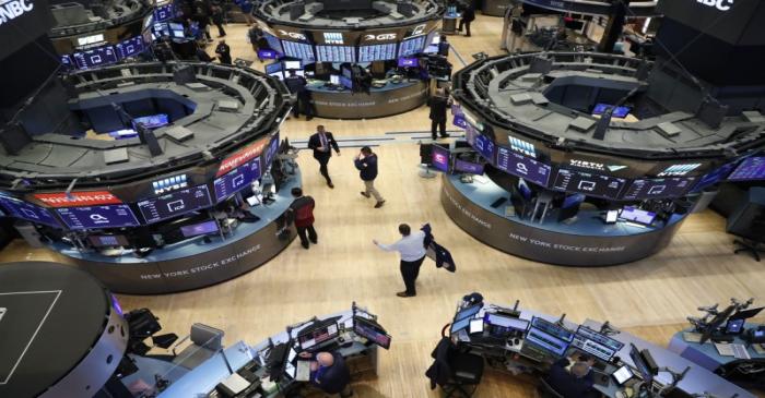 Traders work on the floor of the NYSE in New York