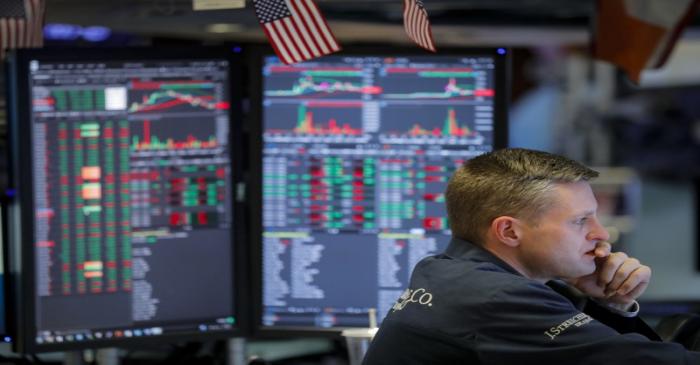 Traders work on the floor of the NYSE in New York