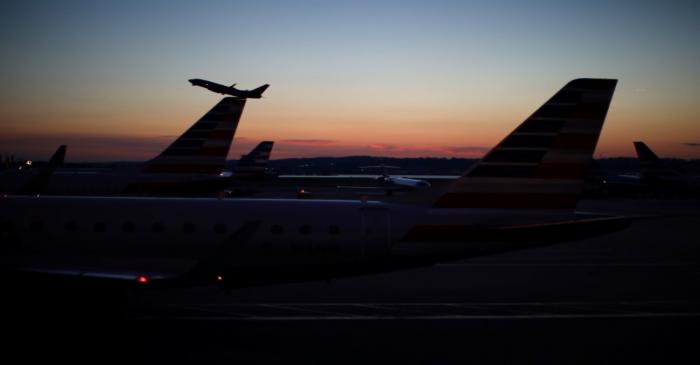 An airplane takes off from the Ronald Reagan National Airport as air traffic is affected by the