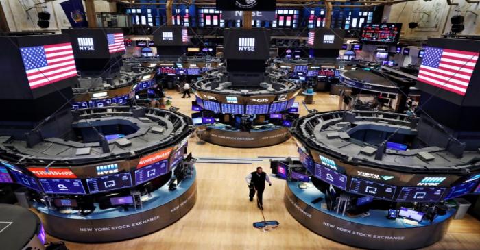 A worker cleans the floor of the New York Stock Exchange (NYSE) as the building prepares to