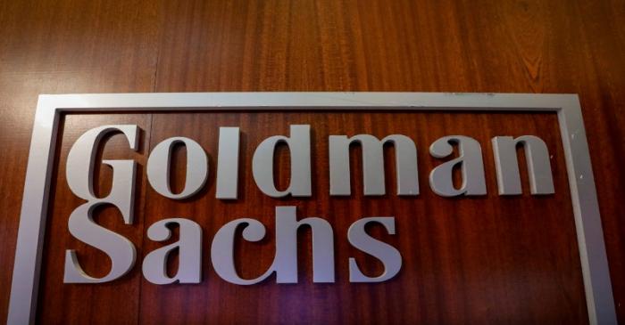 FILE PHOTO: The Goldman Sachs company logo is seen in the company's space on the floor of the