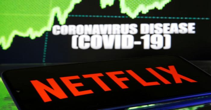 FILE PHOTO: Netlix logo is seen in front of diplayed coronavirus disease (COVID-19)
