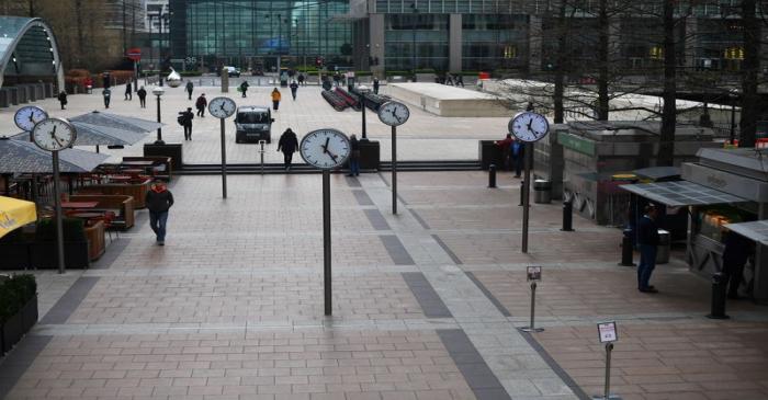 FILE PHOTO: A usually crowded Canary Wharf is seen at lunchtime in London