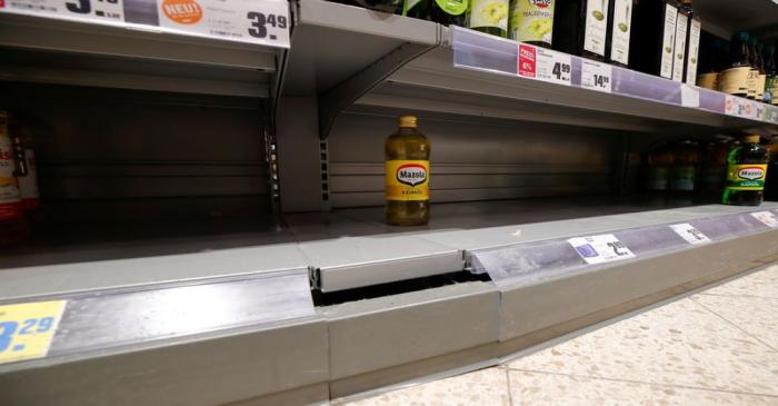 FILE PHOTO: Empty supermarket shelfs due to coronavirus (COVID-19) related panic buys over the