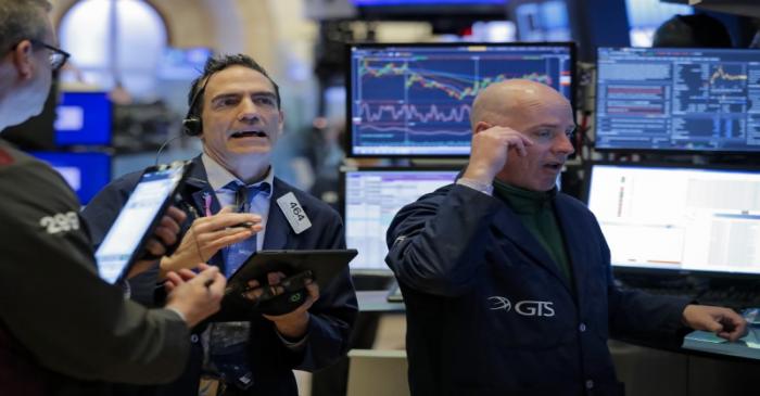 FILE PHOTO:  Traders work on the floor of the NYSE in New York