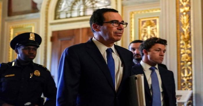 U.S. Secretary of the Treasury Mnuchin walks to the meeting for a coronavirus relief package in