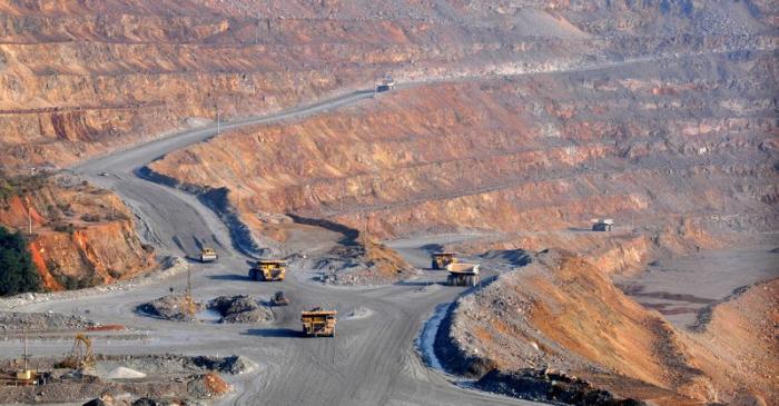 FILE PHOTO: Trucks are seen at a copper mine of Jiangxi Copper in Dexing, Jiangxi