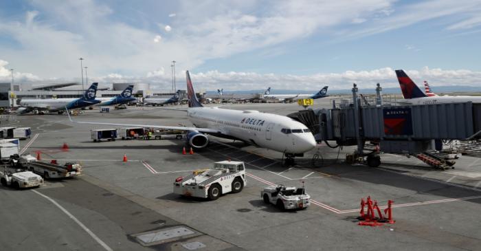 Planes are seen parked at gates at San Francisco International Airport