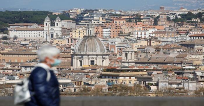 A woman walks at Gianicolo hill, as Italy tightens measures to try and contain the spread of