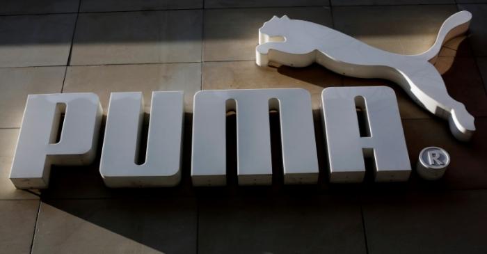 FILE PHOTO: The logo of German sports goods firm Puma is seen at the entrance of one of its