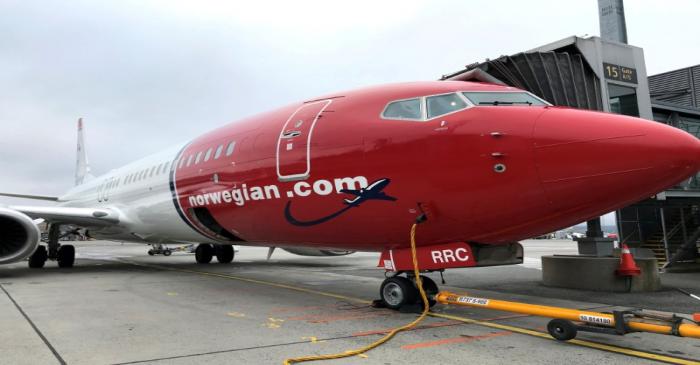 FILE PHOTO: A Norwegian Air plane refuels at Oslo Gardermoen airport