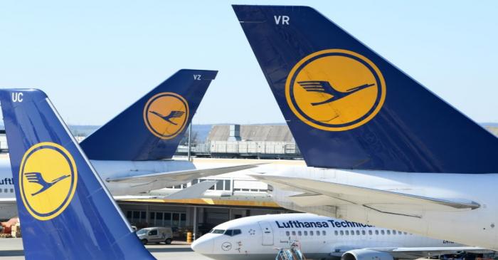 FILE PHOTO: Airplanes of German carrier Lufthansa are parked on the tarmac as air traffic is