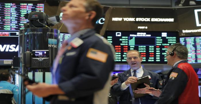FILE PHOTO:  Traders work on the floor of the NYSE in New York