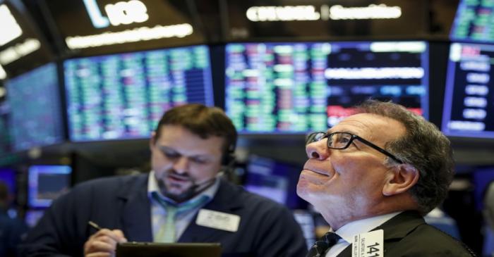 FILE PHOTO:  Traders work on the floor of the NYSE in New York