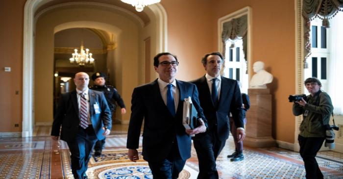U.S. Secretary of the Treasury Steven Mnuchin walks to a meeting during negotiations on a