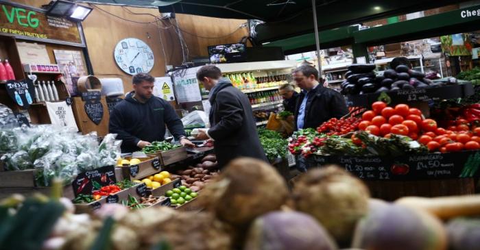 Customers at a food stall at Borough Market in London