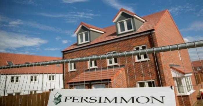FILE PHOTO: A sign is displayed at a Persimmon construction site in Dartford, southern Britain