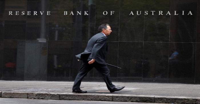 A businessman walks past the Reserve Bank of Australia in Sydney