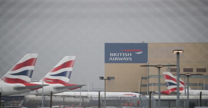 Parked British Airways planes are seen at Heathrow Airport in London