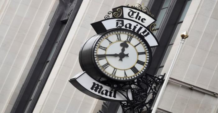 A clock face is seen outside of the London offices of the Daily Mail newspaper in London,