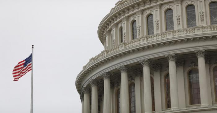 FILE PHOTO: The U.S. Capitol during a morning rainstorm, after Congress agreed to a