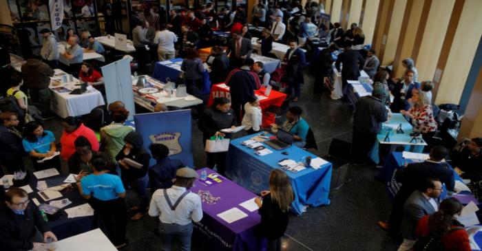 Job seekers speak with potential employers at a City of Boston Neighborhood Career Fair on May