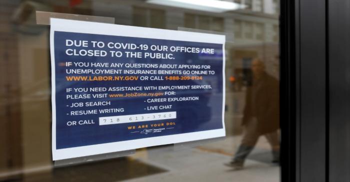 FILE PHOTO: Signage is seen posted on the entrance of the New York State Department of Labor