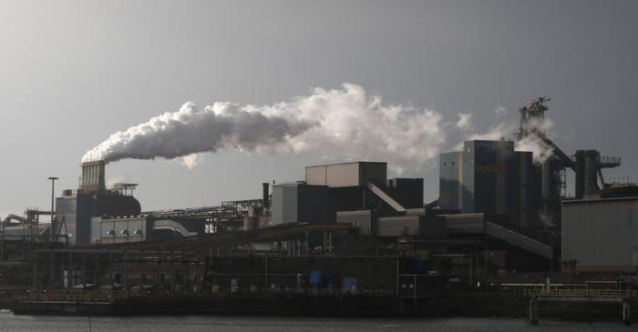 FILE PHOTO: Smoke is seen coming out of a chimney at the Tata steel plant in Ijmuiden