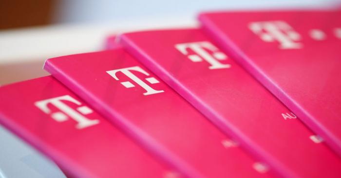 Brochures with the logo of Deutsche Telekom AG are pictured at the shop in the headquarters of