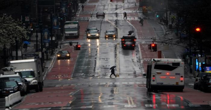 Person crosses a mostly deserted 42nd Street in Manhattan
