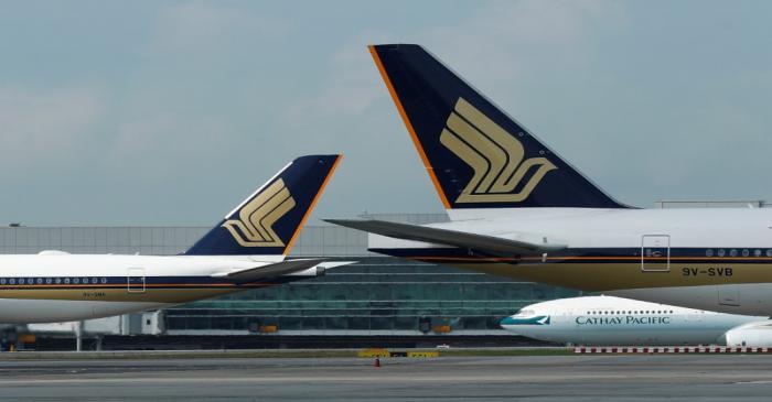 Singapore Airlines planes are pictured on the tarmac at Changi Airport